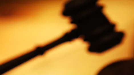Commission takes Vodafone to court